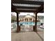 A community pool viewed under a pergola at 2244 Ashley Crossing Dr # 1236, Charleston, SC 29414