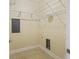 Empty walk-in closet with tile flooring, shelves, and utility box at 2244 Ashley Crossing Dr # 1236, Charleston, SC 29414