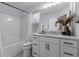 Bathroom featuring modern fixtures, marble countertops, a large mirror, and stylish decor at 2280 Bailey Dr, Charleston, SC 29405