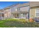 A townhouse backyard offers a cozy outdoor space with a lawn and a covered patio at 234 Darcy Ave, Goose Creek, SC 29445