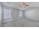 Bedroom featuring a fan, bright natural light, and neutral carpet at 234 Darcy Ave, Goose Creek, SC 29445