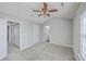 Inviting carpeted bedroom with neutral walls, ceiling fan, and ensuite access, creating a serene and functional space at 234 Darcy Ave, Goose Creek, SC 29445