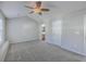 Spacious bedroom with plush carpet, ceiling fan, and ensuite bathroom access, offering a comfortable retreat at 234 Darcy Ave, Goose Creek, SC 29445