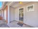 Covered entryway featuring a glass door, neutral siding, and a welcoming doormat at 234 Darcy Ave, Goose Creek, SC 29445