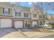 Inviting townhome showcasing brick accents, attached garages, and lovely curb appeal at 234 Darcy Ave, Goose Creek, SC 29445