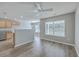 Bright living area featuring wood floors, neutral walls, and adjacent kitchen at 234 Darcy Ave, Goose Creek, SC 29445