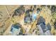 Aerial view of a home featuring a private pool, large driveway, mature landscaping, and waterfront access at 2399 Furman Dr, Charleston, SC 29414