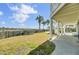 Lush backyard with palm trees offering a relaxing space with views of the waterway and a charming outdoor pool area at 2399 Furman Dr, Charleston, SC 29414