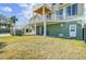 Spacious backyard with multi-level decks and stairs, perfect for outdoor entertaining with coastal views at 2399 Furman Dr, Charleston, SC 29414
