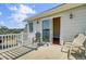 Balcony with waterfront view and outdoor seating with sliding door access to indoor living at 2399 Furman Dr, Charleston, SC 29414