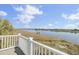 Serene balcony view overlooking the waterway, with marsh grass and blue skies creating a tranquil outdoor space at 2399 Furman Dr, Charleston, SC 29414