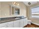 Well-lit bathroom featuring granite countertops and wooden flooring with a picturesque waterfront view at 2399 Furman Dr, Charleston, SC 29414