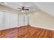 Cozy bedroom with hardwood flooring, closet doors, and neutral paint at 2399 Furman Dr, Charleston, SC 29414