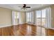 Spacious bedroom with wood floors, neutral walls, and multiple windows offering water views at 2399 Furman Dr, Charleston, SC 29414