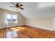 Spacious bedroom with wood flooring, ceiling fan, window with view, and natural light at 2399 Furman Dr, Charleston, SC 29414