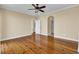 Spacious bedroom with a ceiling fan, hardwood floors, and neutral walls at 2399 Furman Dr, Charleston, SC 29414