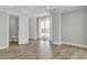Light bedroom showcasing wood floors, access to a private balcony and a nearby bathroom at 2399 Furman Dr, Charleston, SC 29414