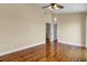 Large bedroom with natural light, hardwood floors, ceiling fan, and multiple doorway entrances at 2399 Furman Dr, Charleston, SC 29414