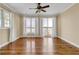 Spacious bedroom with wood floors, neutral walls, and multiple windows offering water views at 2399 Furman Dr, Charleston, SC 29414