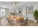 Open-concept dining area with ample seating and views of the modern kitchen and living spaces at 2399 Furman Dr, Charleston, SC 29414