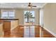 Charming dining area with waterfront views, hardwood floors, and access to a deck, perfect for enjoying meals with a view at 2399 Furman Dr, Charleston, SC 29414
