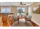 Inviting dining area with hardwood floors, a stylish dining set, and scenic views, creating a perfect setting for meals at 2399 Furman Dr, Charleston, SC 29414