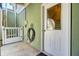 Exterior side entrance featuring a lift, door with window, and unique stone-tiled outdoor flooring at 2399 Furman Dr, Charleston, SC 29414