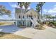 Charming two-story home with a spacious front yard and inviting staircase at 2399 Furman Dr, Charleston, SC 29414
