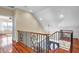 Foyer staircase with wrought iron spindles and a view of the front door at 2399 Furman Dr, Charleston, SC 29414
