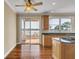 Open kitchen with sliding glass door to outdoor deck and water views at 2399 Furman Dr, Charleston, SC 29414