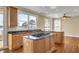 Open concept kitchen with granite countertops, stainless steel appliances and wood cabinets at 2399 Furman Dr, Charleston, SC 29414