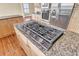 Kitchen island featuring granite countertops and a gas cooktop at 2399 Furman Dr, Charleston, SC 29414