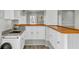 Charming kitchen with granite countertops, a wooden ledge, and modern white cabinetry at 2399 Furman Dr, Charleston, SC 29414
