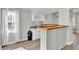 Kitchen area with convenient wet bar, wooden counter and lots of natural light at 2399 Furman Dr, Charleston, SC 29414