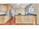 Well-appointed kitchen with granite countertops, stainless steel appliances, and hardwood floors, designed for functionality and style at 2399 Furman Dr, Charleston, SC 29414