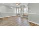 Living room with wood flooring, built in benches, a ceiling fan and natural light at 2399 Furman Dr, Charleston, SC 29414