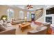 Cozy living room with hardwood floors, comfortable seating, and a fireplace, creating a welcoming space for Gathering and friends at 2399 Furman Dr, Charleston, SC 29414