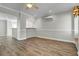 Bright living room featuring wood floors, neutral paint, ceiling fan and decorative trim details at 2399 Furman Dr, Charleston, SC 29414
