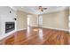 Spacious living room with hardwood floors, a fireplace, and abundant natural light, creating a warm and inviting atmosphere at 2399 Furman Dr, Charleston, SC 29414