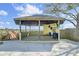 Outdoor kitchen cabana features a bar, grill, sink, and a covered deck for dining and entertaining, plus an adjacent walkway at 2399 Furman Dr, Charleston, SC 29414