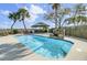 Refreshing pool area with waterfall feature and nearby cabana, offering a serene and private outdoor experience at 2399 Furman Dr, Charleston, SC 29414