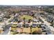 Overhead view of a serene suburban neighborhood with a tranquil pond, tree-lined streets, and well-maintained homes at 2508 Melville Rd, North Charleston, SC 29406