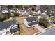 An attractive two-story home features a classic design and a well-manicured lawn in a suburban neighborhood at 2508 Melville Rd, North Charleston, SC 29406