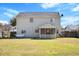 Back exterior with a patio, a hammock, and a well-maintained lawn at 2508 Melville Rd, North Charleston, SC 29406