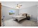 Inviting bedroom with neutral tones, a ceiling fan, and a comfortable bed with decorative pillows at 2508 Melville Rd, North Charleston, SC 29406