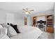 Bedroom with a well-lit desk, ceiling fan, and plush pillows on the bed at 2508 Melville Rd, North Charleston, SC 29406