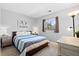 Bedroom with neutral decor, natural light and decorative lamps at 2508 Melville Rd, North Charleston, SC 29406