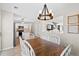 Dining area with wood table and chairs adjacent to kitchen, ideal for Gathering meals at 2508 Melville Rd, North Charleston, SC 29406