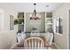 Cozy dining room showcasing a wooden table with white chairs and stylish light fixture at 2508 Melville Rd, North Charleston, SC 29406