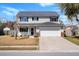 Inviting two-story home with a well-manicured lawn and an attached two-car garage at 2508 Melville Rd, North Charleston, SC 29406